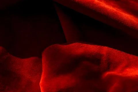 Dark red matte background of suede fabric, closeup. Velvet texture of seamles 写真素材