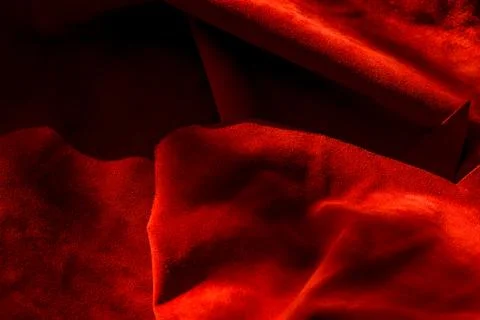 Dark red matte background of suede fabric, closeup. Velvet texture of seamles Foto stock
