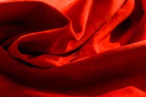 Dark red matte background of suede fabric, closeup. Velvet texture of seamles Foto stock