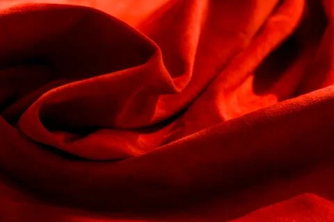 Dark red matte background of suede fabric, closeup. Velvet texture of seamles Foto stock