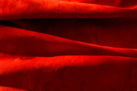 Dark red matte background of suede fabric, closeup. Velvet texture of seamles Foto stock