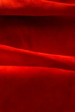 Dark red matte background of suede fabric, closeup. Velvet texture of seamles 写真素材