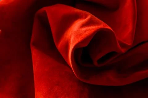 Dark red matte background of suede fabric, closeup. Velvet texture of seamles 스톡 사진