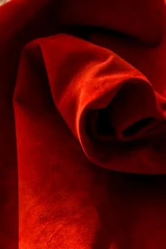 Dark red matte background of suede fabric, closeup. Velvet texture of seamles Foto stock