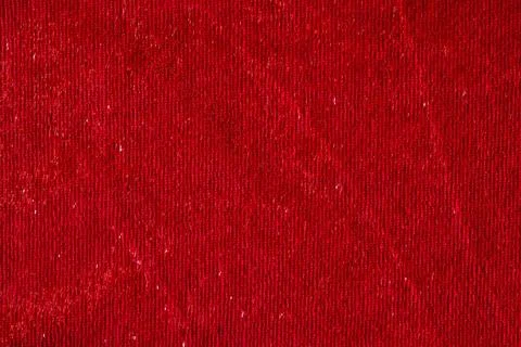 Dark red smooth textile material with shiny thread textured background 写真素材