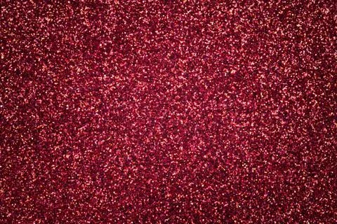 Dark red sparkling background from small sequins, closeup. Brilliant backdrop Stock Photos