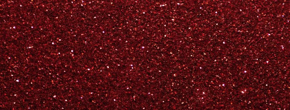 Dark red sparkling background from small sequins, macro. Wine shiny backdrop Stock Photos