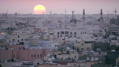 Dark red sun sets over the middle eastern skyline. Stock Footage 157396588
