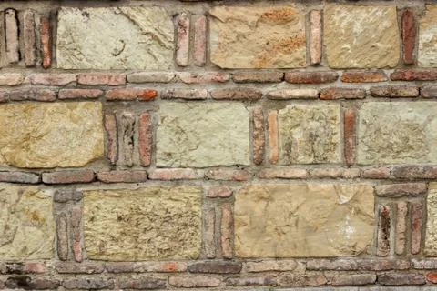 A dark red texture from an old brick wall. A destructive destruction of a bri Foto stock