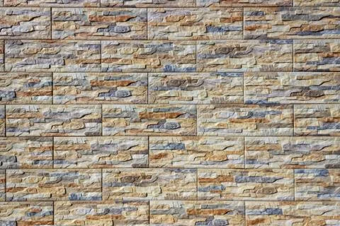 A dark red texture from an old brick wall. A destructive destruction of a bri Stock Photos