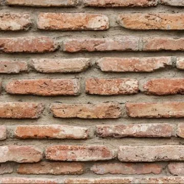 A dark red texture from an old brick wall. A destructive destruction of a bri Stock-Fotos