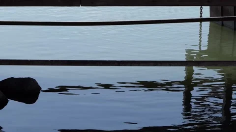 Dark reflections in wavy water Stock Footage 237683810