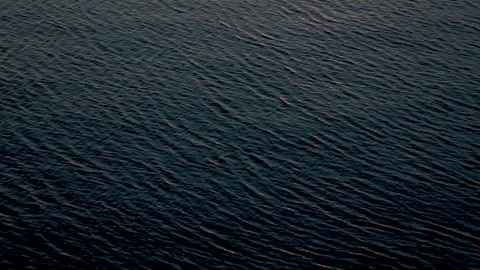 Dark Ripples in Water at Sunset 스톡 동영상 90104703
