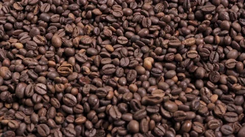 Dark roast coffee beans background, top view Stock Footage 193588575