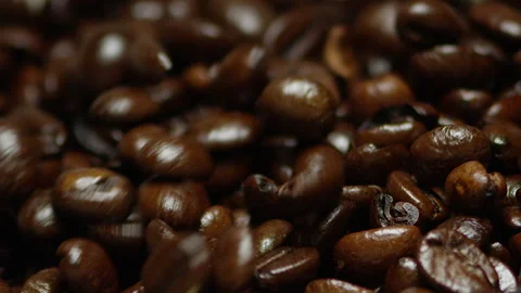 Dark roast coffee beans slow- motion capture Stock Footage 142070894