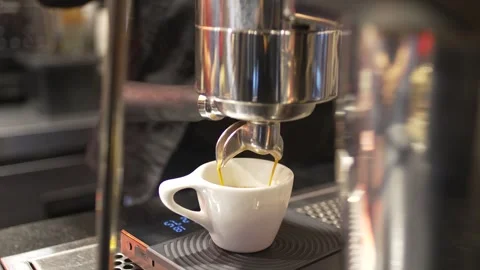 Dark Roast Espresso Extraction with Golden Crema at Professional Cafe Bar Stock Footage 336485974
