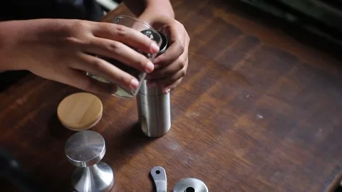 Dark roasted bean poured by home barist Stock Footage 203770553