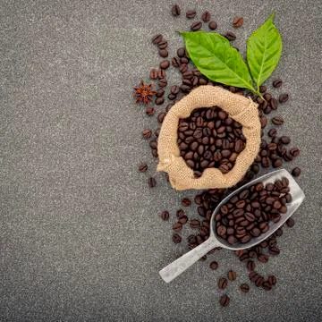 Dark roasted coffee beans on stone background. Top view with copyspace. Stock Photos