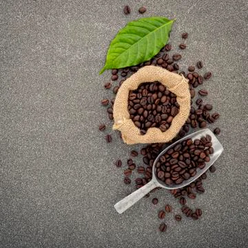 Dark roasted coffee beans on stone background. Top view with copyspace. 写真素材