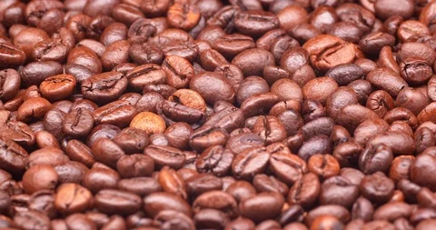 Dark roasted coffee beans on a turntable in C4K resolution Видео 99331191