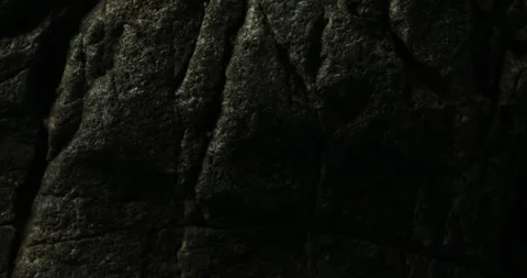 Dark Rock Surface with Deep Natural Crevices Stock Footage 291944156