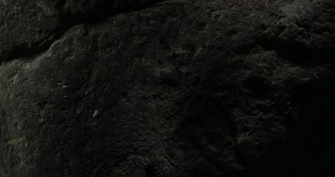 Dark Rocky Surface with Natural Cracks Close-Up Stock Footage 295143761