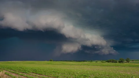 Dark rolling storm clouds moving across dramatic sky 4K timelapse Stock-Footage 338172333