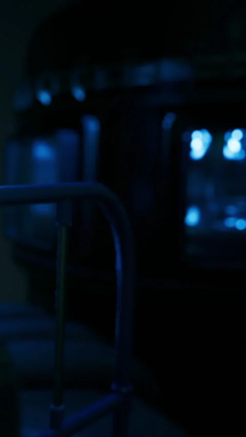 Dark room with blue lights and metal bed frame during night time hours Stock Footage 334171407