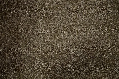A dark rough surface of a painted wall with areas of light colors. Blank fo.. Stock Photos