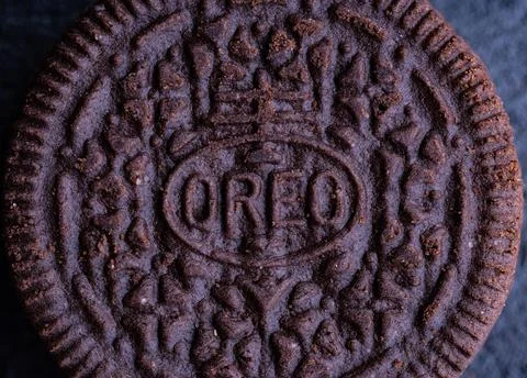 Dark round cookie close-up on a stone Stock Photos