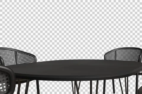 A dark, round table sits centered with woven-back chairs peeking on sides 库存照片