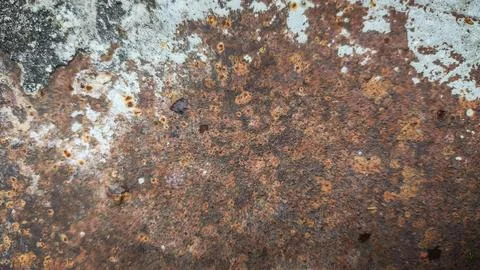 Dark rust buildup on an old corroded sheet metal surface. Rough iron textur.. Stock Photos