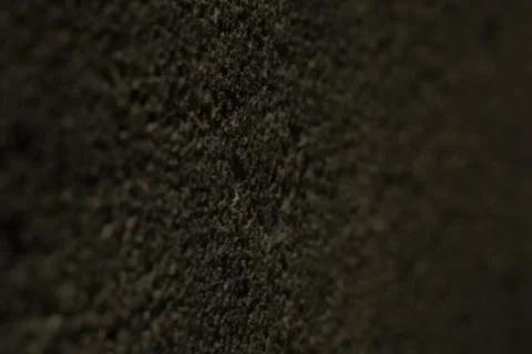  Dark rustic textured stone wall by night Stock Photos