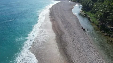 Dark sand beach with whitewash surf, aerial view Stock Footage 278369022