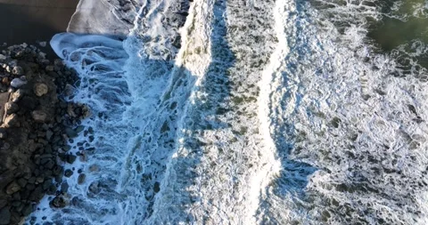 Dark Sand White Surf and Rocks Drone Aerial Pacifica San Fancisco California USA Stock Footage 194748736