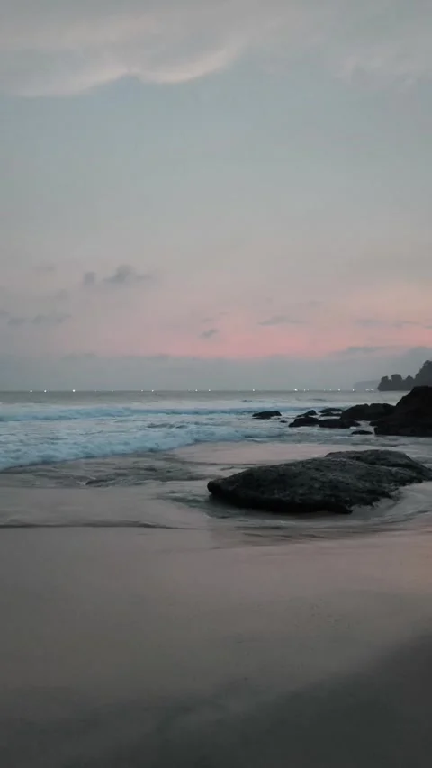 Dark Sandy Beach with Coral Rocks When It Gets Dark. Stock Footage 333497446