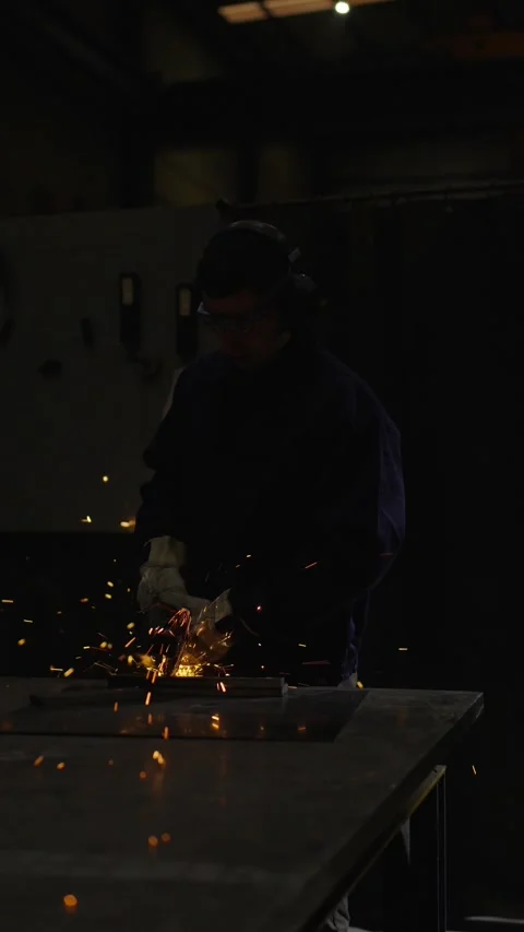 Dark scene of worker cutting metal Stock Footage 266459895