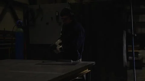 Dark scene of worker cutting metal Stock Footage 267484294