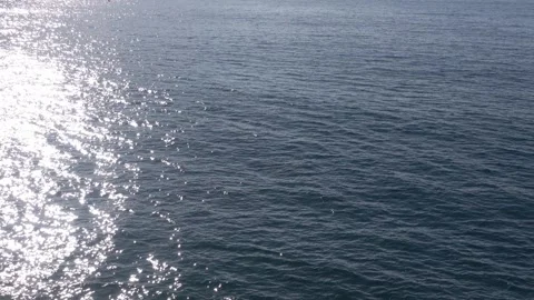 Dark sea water motion pattern, sun glitter, breezy wind surface texture Video stock 332719844