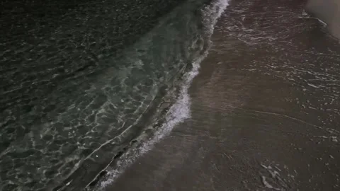 Dark sea water surface at night with illuminated texture and ripples Video stock 338321438