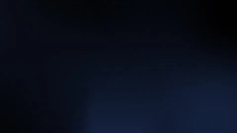 Dark seamless loop background in 4K with deep blue gradient shades. Stock Footage 300840081