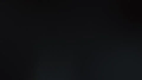 Dark seamless loop background with a smooth black gradient. 4K resolution. Stock Footage 309700876