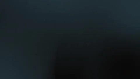 Dark seamless loop background with subtle grid lines and gradient effect. Deep Stock Footage 299397335