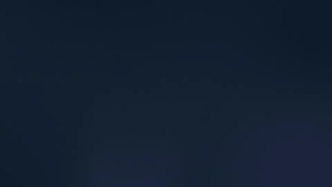 Dark seamless loop background with subtle gradient in 4K. Shades of navy to Stock Footage 300840101