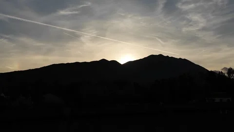 A dark shadow of mountains at sunset. Stock Footage 317628854