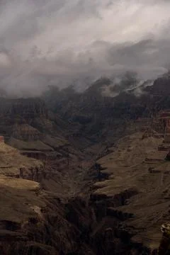 Dark Shadows Below The Thick Clouds At The Top of Grand Canyon Фото