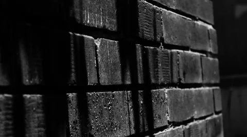 Dark shadows on a brick wall Stock Footage 34579525