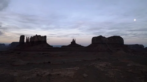 Dark shadows of Monument Valley rock formations under a full moon Video stock 124808264