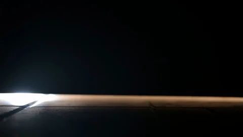 Dark shadows of people glimpsed from under the front door Stock Footage 128000918