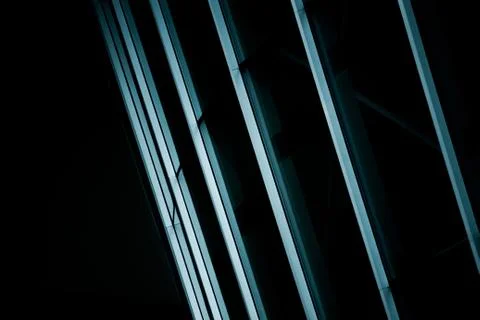 Dark shot of bars lined up to create a symmetrical pattern Stock Photos